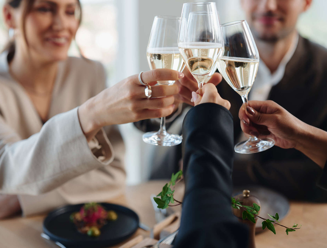 Guests toasting with sparkling wine at Upper House